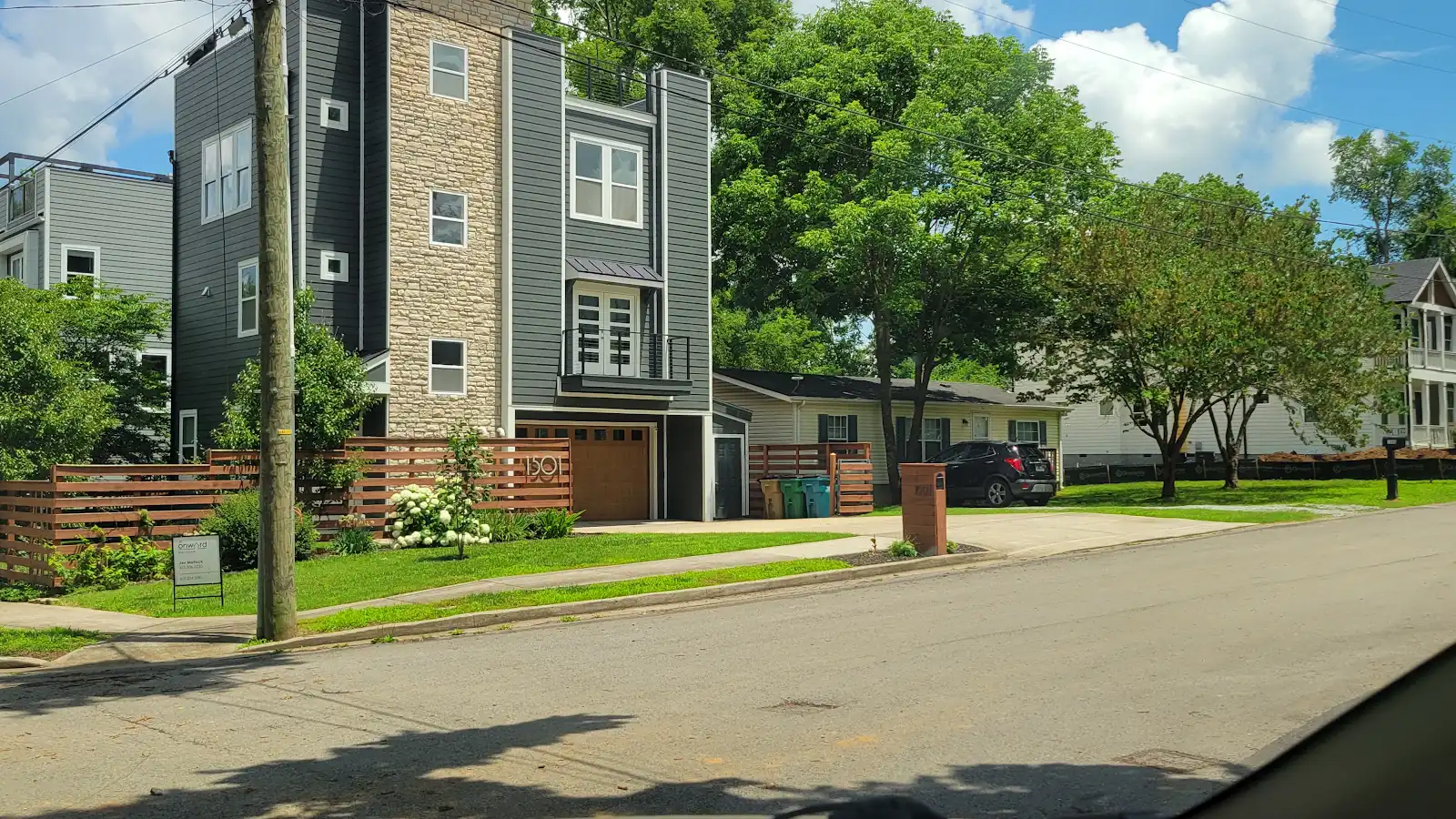 Nashville-area residential streetscape with a mix of newer and established homes.